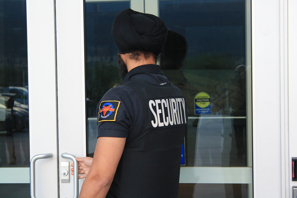 Hero Security Guard entering building