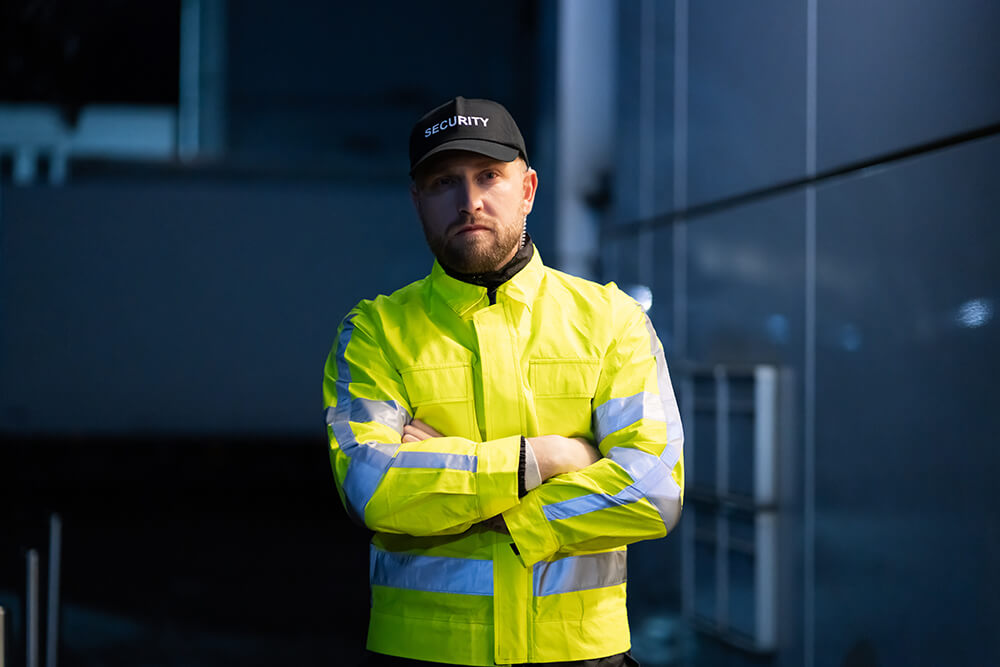 Male Security Guard Standing At The Entrance