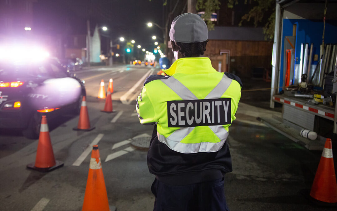 Security guard in car patroling at construction site