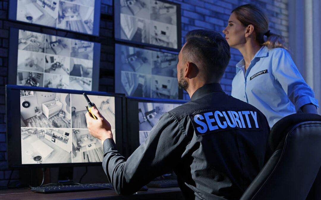 Security guards monitoring modern CCTV cameras