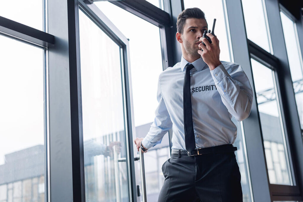 guard in suit talking on walkie-talkie