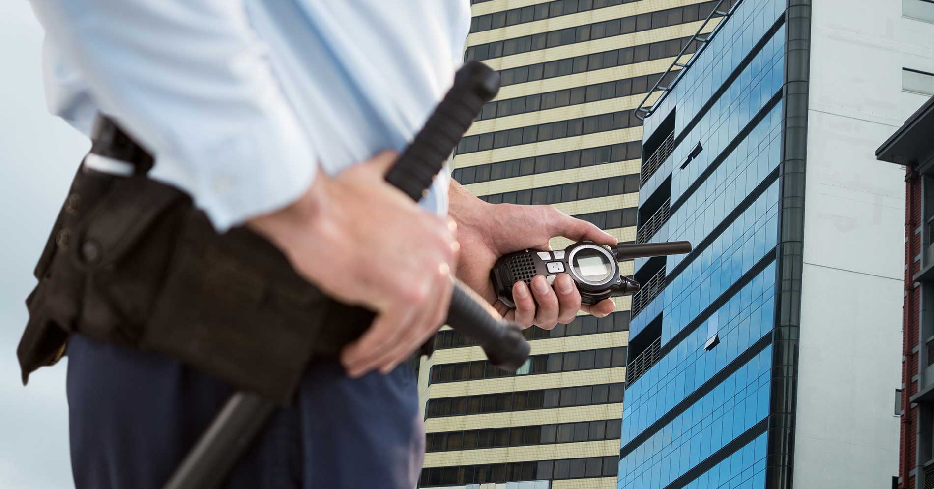 security guard outside with a walkie talkie