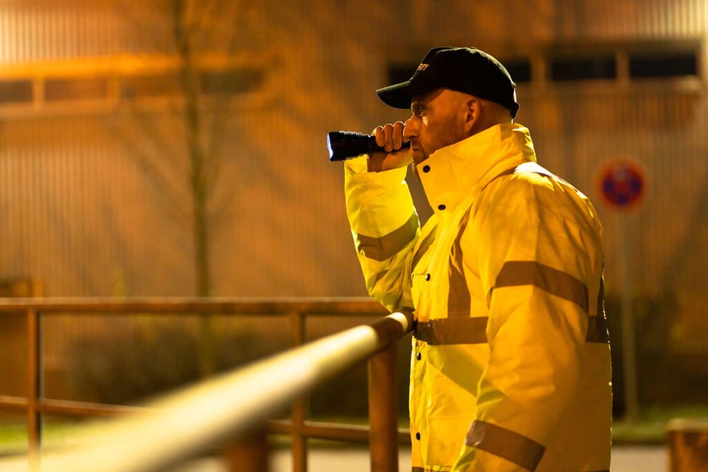 security overseeing an outdoor construction yard